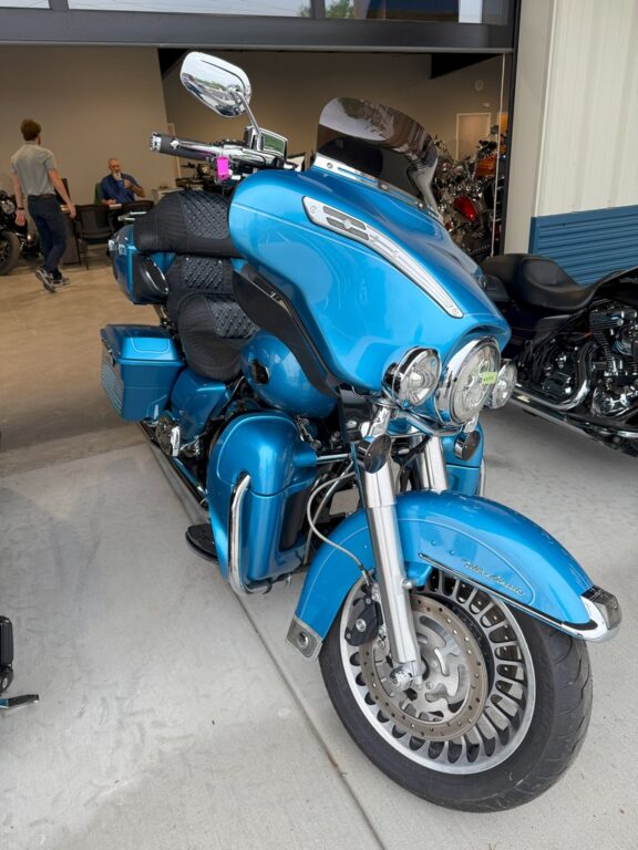 Front corner view of blue 2011 Harley